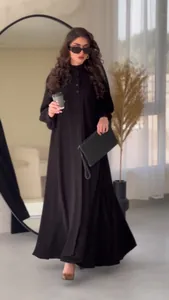 Elegant black maxi dress featuring a buttoned bodice and a full flared skirt design.