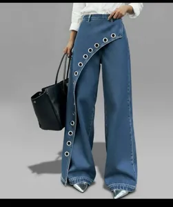 Detail of high waist wide-leg denim pants featuring diagonal metal eyelet design
