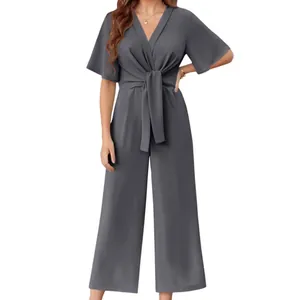 Elegant grey V-neck short sleeve jumpsuit with waist tie and wide leg design.