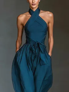 Detailed view of women's teal linen halter-neck wide-leg jumpsuit with waist tie