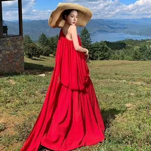Elegant red pleated one-shoulder flowy resort maxi dress with dramatic long trail for travel