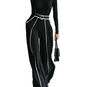Elegant black two-piece set for women with high neck top and white striped wide leg trousers