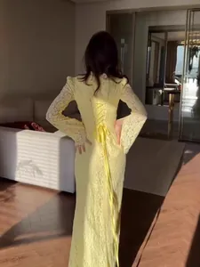 Victorian style yellow lace long sleeve maxi dress with elegant back ribbon detail
