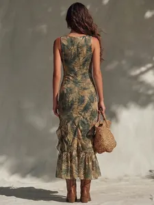 Elegant back view of tropical leaf print sleeveless maxi dress featuring a ruffled fishtail hem