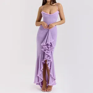 Elegant lavender spaghetti strap maxi dress with ruffled trim and ruched mermaid style hem.