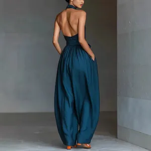 Elegant linen halter neck backless wide leg jumpsuit for women in sophisticated navy blue.