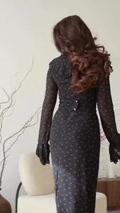 Detailed back view of a black chiffon floral long dress featuring elegant ruffle sleeves