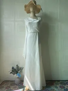 Detail showing the elegant draping and silky texture of this white one-shoulder gown