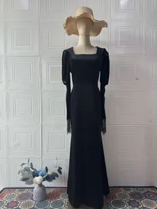 Elegant vintage square neck black velvet maxi dress featuring detailed lace cuffs
