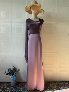 Elegant purple silk long-sleeved maxi dress with asymmetrical pleated top design