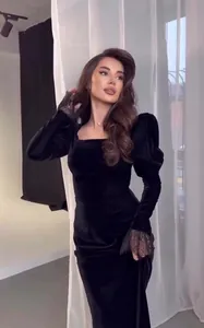 Elegant vintage black velvet long dress with puff sleeves and delicate lace cuffs details