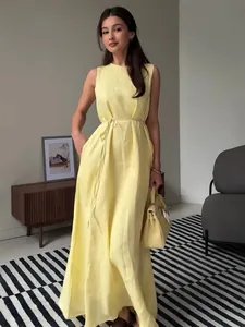 Elegant sleeveless yellow maxi dress with waist tie and pockets for summer casual wear