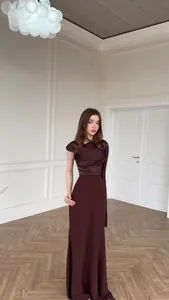Elegant long burgundy asymmetrical evening gown with silky bodice and ruched sleeve.