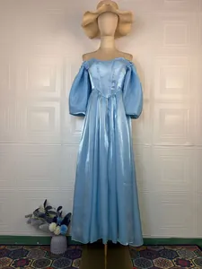 Elegant light blue off-the-shoulder princess gown with puff sleeves for formal events.