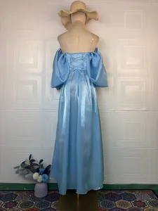 Back detail of a shimmering light blue off-the-shoulder gown with lace-up back design