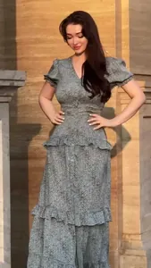 Full view of elegant vintage floral maxi dress with ruffled tiers and puff sleeves