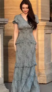 Elegant tiered floral maxi dress with short puff sleeves and cinched waist for summer wear