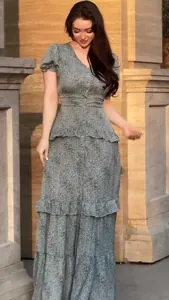 Detailed view of a retro grey floral maxi dress with short sleeves and ruffled skirt