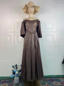 Elegant chocolate brown satin evening gown with off-the-shoulder design on a mannequin