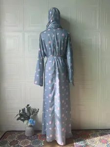 Back view of elegant light blue floral print long sleeve maxi dress with matching hijab.