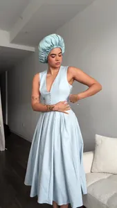 Elegant light blue V-neck sleeveless maxi dress paired with a matching satin hair bonnet