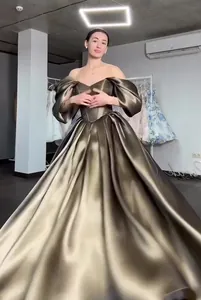 Macro view of luxurious metallic fabric on off-the-shoulder princess ball gown