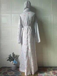 Back view of elegant floral printed long-sleeved maxi dress with matching headscarf