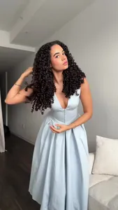 Elegant light blue V-neck sleeveless maxi dress for women in a modern indoor setting.