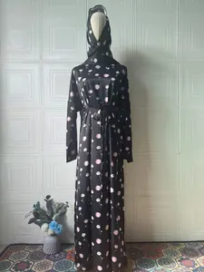 Full view of elegant black long sleeve maxi dress with pink floral prints and hijab