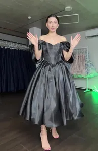 Elegant off-the-shoulder shiny charcoal satin princess gown with puffed sleeves