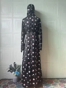Elegant back view of black floral print long sleeve maxi dress with matching hijab hood.