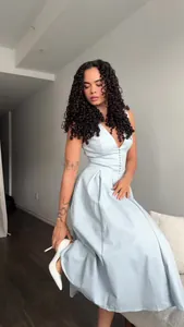 Elegant light blue V-neck sleeveless midi dress with front button details for women
