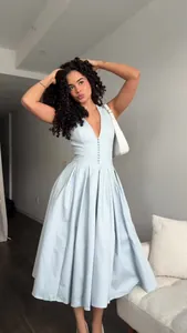 Elegant light blue V-neck sleeveless midi dress for 2025 Spring fashion season look