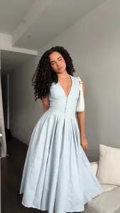 Elegant light blue V-neck sleeveless pleated maxi dress with button detail for women