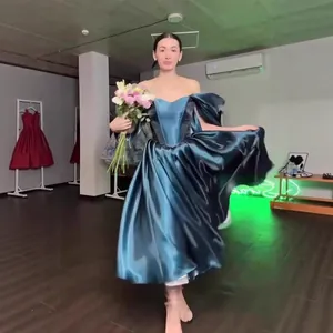 Luxurious dark teal satin princess evening gown with off-shoulder puff sleeves for women