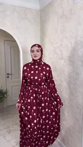 Elegant burgundy floral print maxi dress with long sleeves and matching hijab for modest fashion.