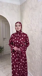 Detail view of a modest burgundy floral print maxi dress with a matching hijab set
