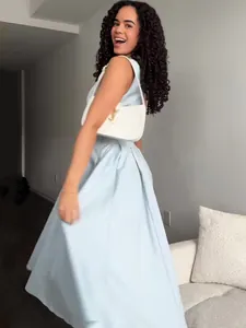 Elegant light blue V-neck sleeveless long dress for women spring style lifestyle view.