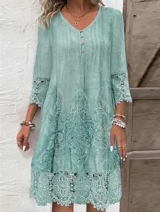 Elegant mint green tunic dress detail with intricate lace trim and vintage floral pattern