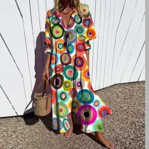 Detail view of a vibrant bohemian maxi dress featuring multi-color concentric circle prints