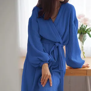 Detailed macro shot of the blue crinkle fabric and balloon sleeves on this elegant dress.