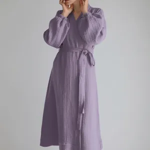 Detailed view of the purple crinkle muslin long-sleeved dress with waist tie.