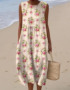 Detail view of sleeveless summer midi dress with pink floral print on cream fabric