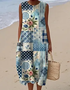 Detail view of sleeveless floral maxi dress with patchwork patterns on beach