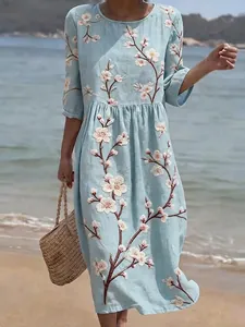 Elegant light blue round neck midi dress featuring intricate white floral embroidery details