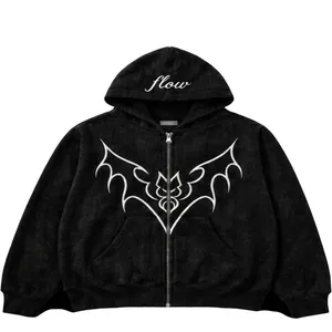 Detail of a black zip-up hoodie featuring a white bat graphic and hood text