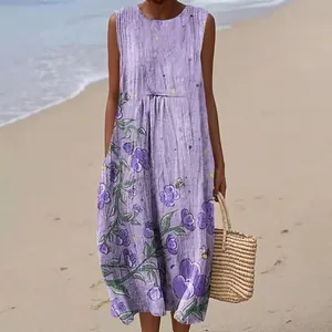 Close-up of purple sleeveless maxi dress with elegant floral print at the beach