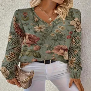 Detail of women's V-neck hollow-out sweater with floral print