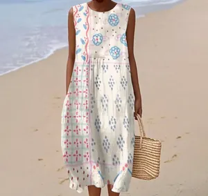 Detailed view of white sleeveless maxi dress with blue and pink floral print