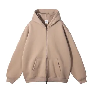 Beige oversized hoodie met rits, kangoeroezakken en geribbelde boorden aan de mouwen